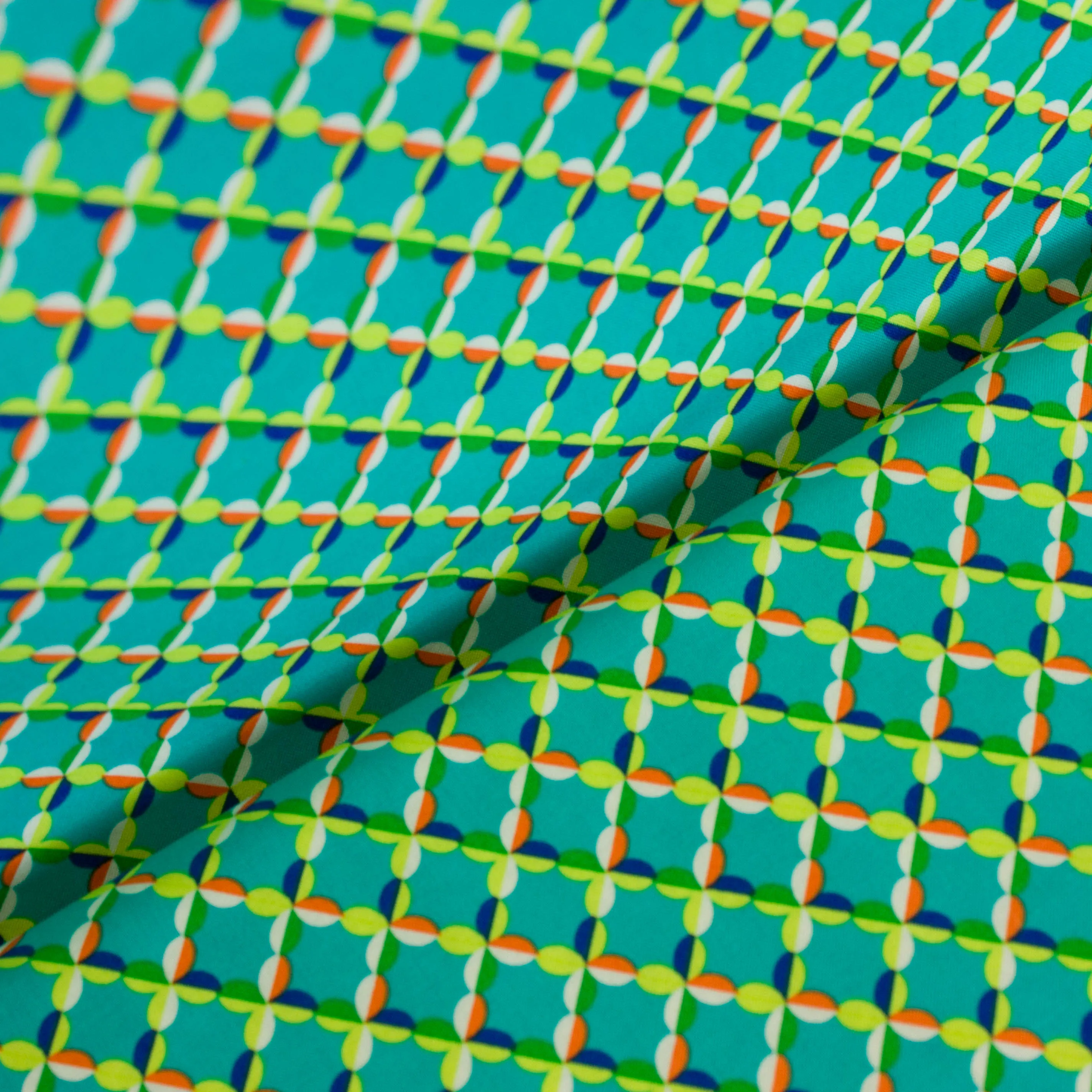 Katoen aquablauw met abstracte figuren